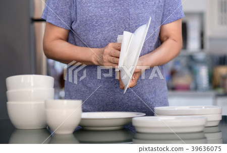 Woman Cleaning product concept wiping dishware 39636075