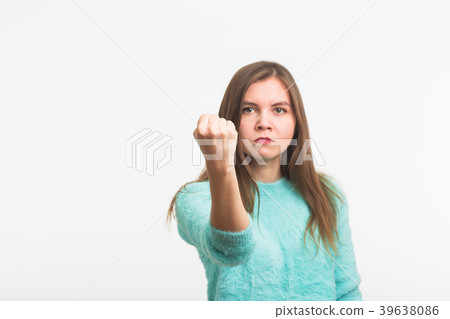 Angry aggressive woman with ferocious expression Angry aggressive woman with ferocious expression 39638086