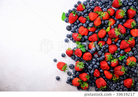 Assortment of strawberry, blueberry, currant, mint 39639217