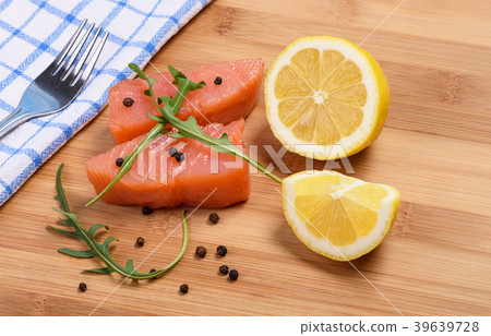 Slices of salmon and fork Slices of salmon and fork 39639728