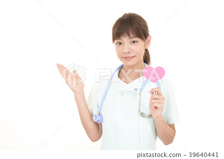 A smiling nurse with a heart mark A smiling nurse with a heart mark 39640441