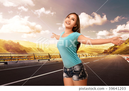 Pretty asian woman enjoying the weather 39641203