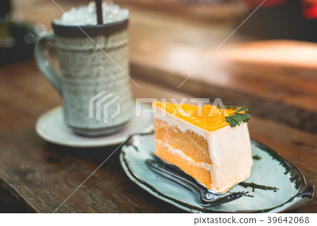Orange cake on the wooden background 39642068
