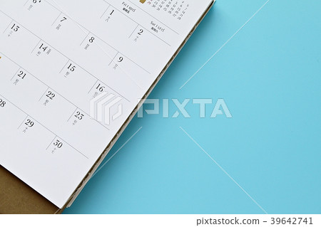 Calendar page on blue background with copy space Calendar page on blue background with copy space 39642741