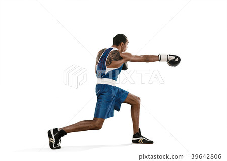 Sporty man during boxing exercise making hit Sporty man during boxing exercise making hit 39642806