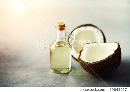 Cracked two halves of fresh organic coconut and Cracked two halves of fresh organic coconut and 39643957