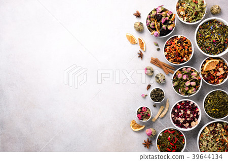 Assortment of dry tea in white bowls. Tea types 39644134