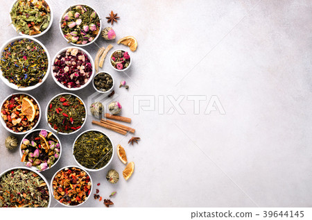Assortment of dry tea in white bowls. Tea types 39644145