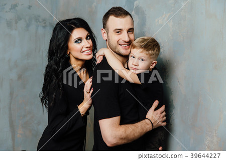 young family having fun at home on a background of young family having fun at home on a background of 39644227