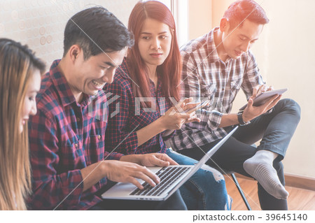 Casual start up brainstorming in co working space Casual start up brainstorming in co working space 39645140