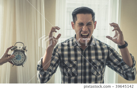 Casual male screaming stressed out alarm clock Casual male screaming stressed out alarm clock 39645142