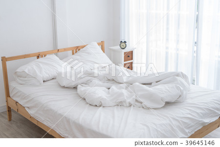 White messy bed in morning without people White messy bed in morning without people 39645146