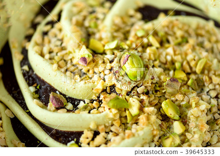 Scooped pistachio ice cream background. Summer Scooped pistachio ice cream background. Summer 39645333