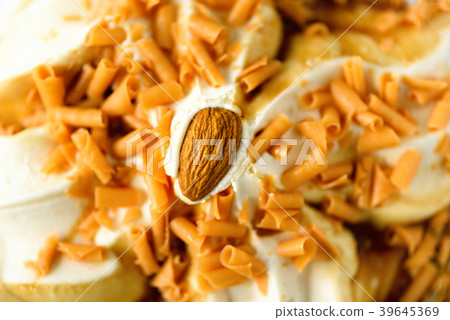 Ice cream with caramel sauce and almond. Summer 39645369