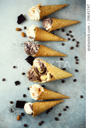 Chocolate and coffee ice cream in waffle cone with Chocolate and coffee ice cream in waffle cone with 39645747