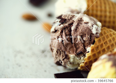 Chocolate and coffee ice cream in waffle cone with 39645766