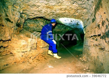 Man in old tunnel, indoor shoot. Stairs to tunnel 39646772