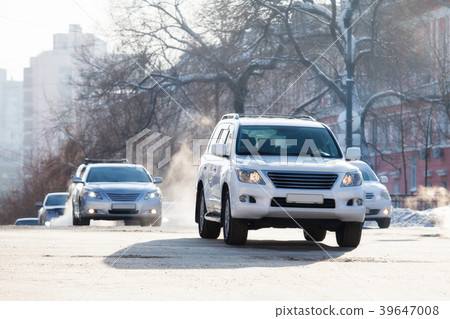 Cars on a crossroad in winter city 39647008