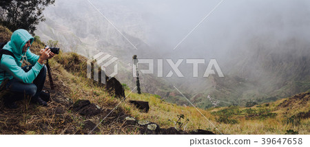 Panoramic shot of traveler making photo of amazing 39647658