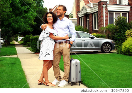 Young couple on the street near his home Young couple on the street near his home 39647890