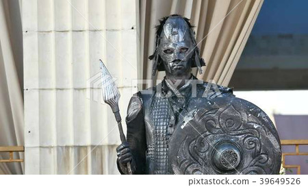 Ancient warrior or Gladiator posing over a dark Ancient warrior or Gladiator posing over a dark 39649526