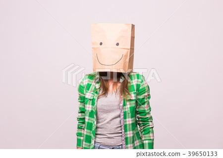 Happy unknown woman with a paper bag on her head 39650133