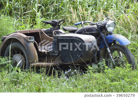 Old Soviet motorcycle with a cradle. An old Old Soviet motorcycle with a cradle. An old 39650279