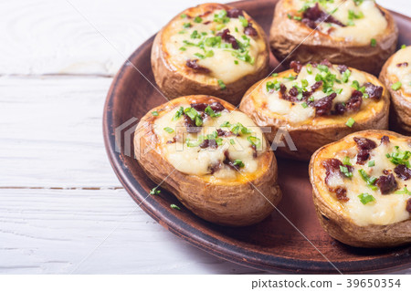Baked potato stuffed with cheese 39650354