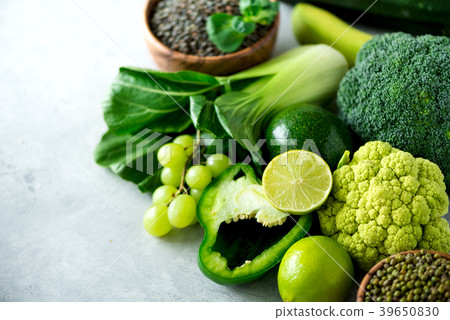 Organic green vegetables and fruits on grey 39650830