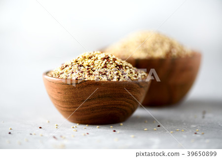 White and red raw organic quinoa in wooden bowl White and red raw organic quinoa in wooden bowl 39650899