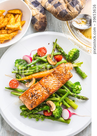 Roasted salmon steak with fresh vegetable. 39653616