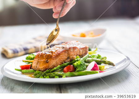 Roasted salmon steak with fresh vegetable. 39653619