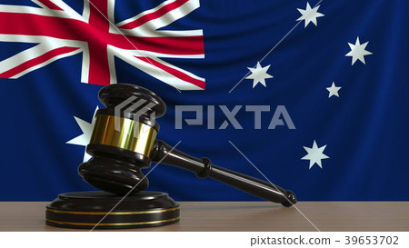 Judge's gavel and block against the flag of 39653702