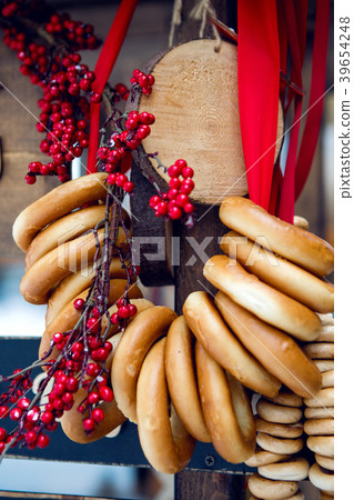 on a wooden stand to hang the bagels and Rowan 39654248