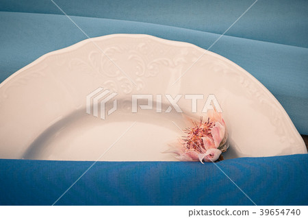 Closeup view of catered table setting, flowers Closeup view of catered table setting, flowers 39654740