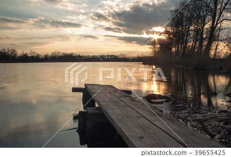 Springboard on shore of lake in the setting sun 5 39655425