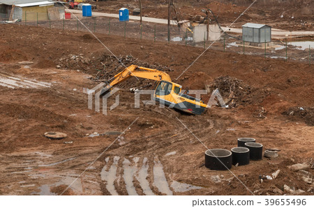 Stuck excavator in the mud 39655496