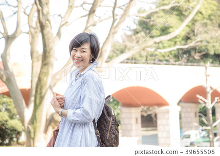 Woman enjoying at Kirishima Bridge in Ga-Hoka Park with harbor view Woman enjoying at Kirishima Bridge in Ga-Hoka Park with harbor view 39655508