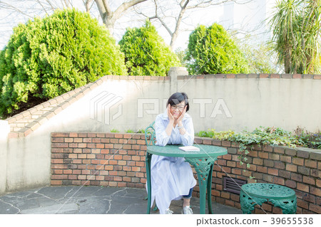 A woman enjoying in the English garden in the ga hill park with a view of the harbor 39655538
