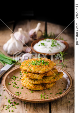 Potato pancakes with sour cream Potato pancakes with sour cream 39659511