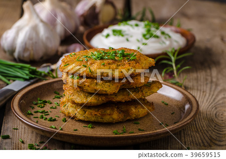 Potato pancakes with sour cream 39659515