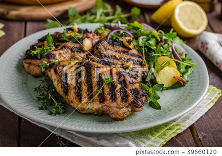 Grilled pork chops with lettuce salad Grilled pork chops with lettuce salad 39660120