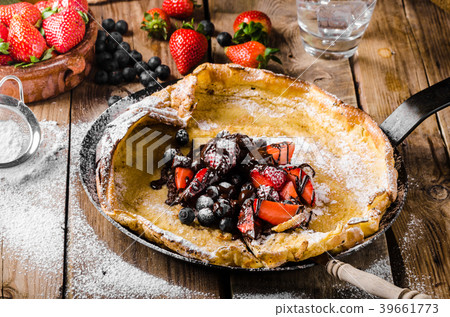 Dutch Baby Pancakes with berries and chocolate 39661773