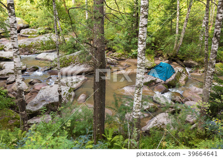Tourist tent on a boulder in the middle of Tourist tent on a boulder in the middle of 39664641