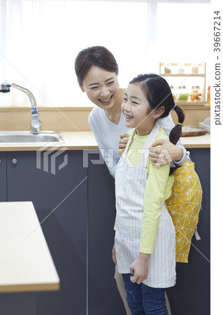 Mother and daughter in the kitchen 39667214