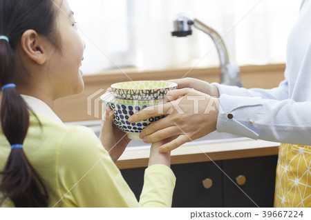 Mother and daughter in the kitchen 39667224