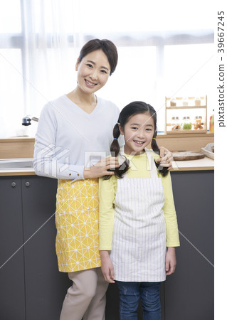 Mother and daughter in the kitchen 39667245