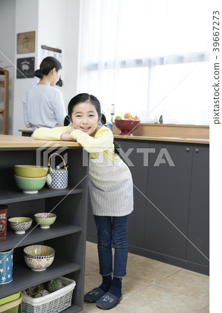 Mother and daughter in the kitchen 39667273