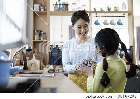 Mother and daughter in the kitchen Mother and daughter in the kitchen 39667292