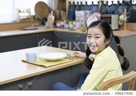 Mother and daughter in the kitchen 39667406